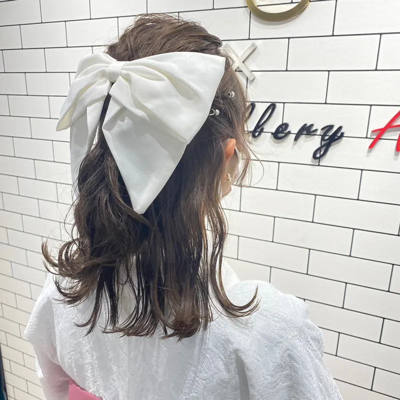 卒業式袴レンタル店アンジュを利用したお客様の写真「髪型・ヘアアレンジ・ヘアセット・大きめリボン×ハーフアップ」
